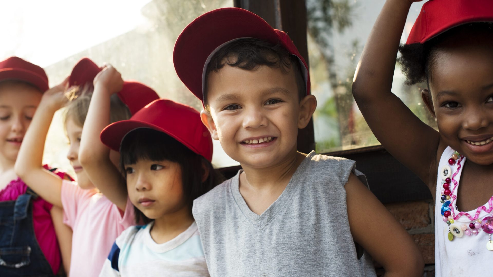 Group of kindergarten kids little farmers learning gardening
